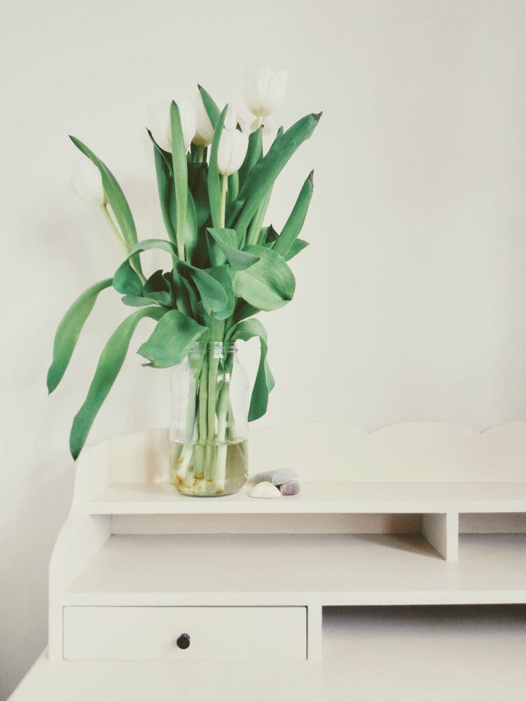 White tulips on white desk